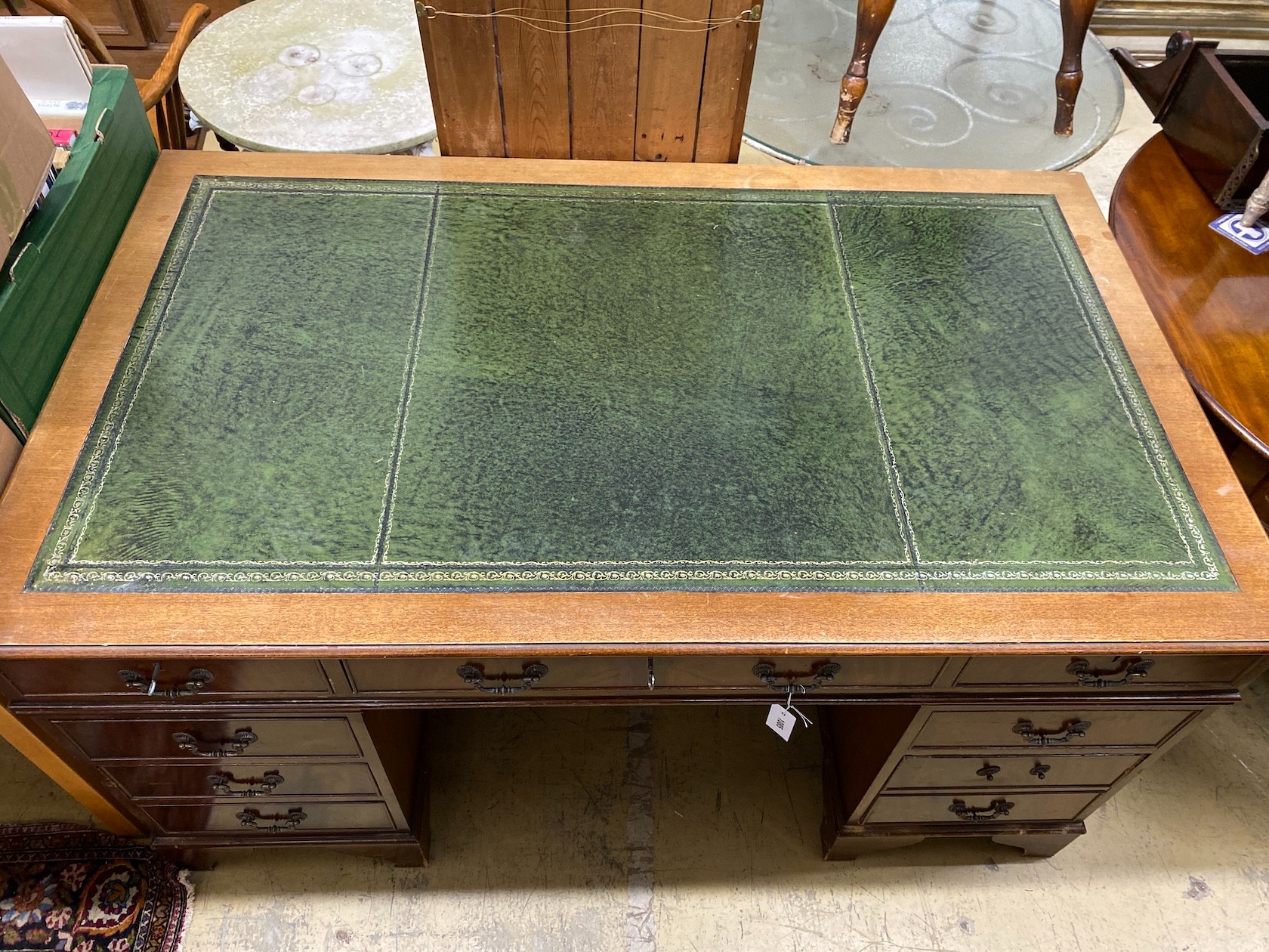 A reproduction George III style mahogany pedestal desk, length 152cm, depth 90cm, height 79cm